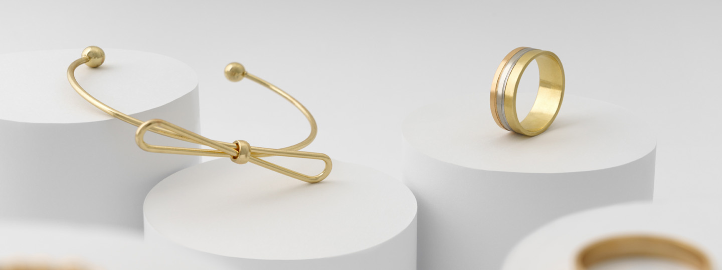 Goldarmband mit einer Schleife , Goldring mit Muster